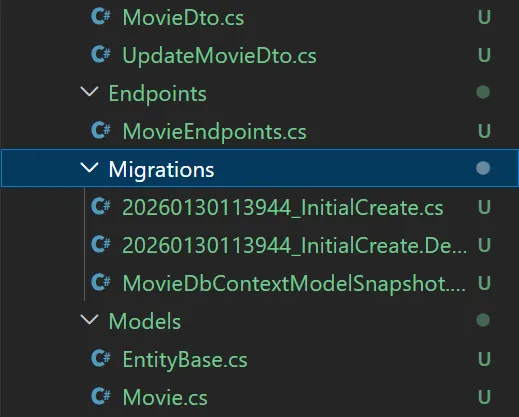 EF Core 10 Code First Migrations Folder Structure with PostgreSQL Entity Framework Core 10 code-first migrations folder structure displaying InitialCreate migration files with ModelSnapshot designer file and database context configuration in Visual Studio 2026 solution explorer